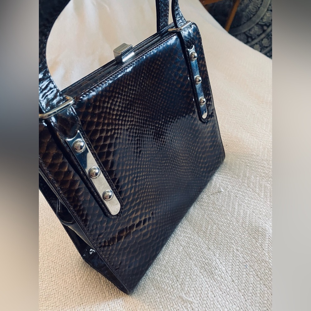 Genuine Leather Snake-Embossed with Silver Clasp closure. Made in France.